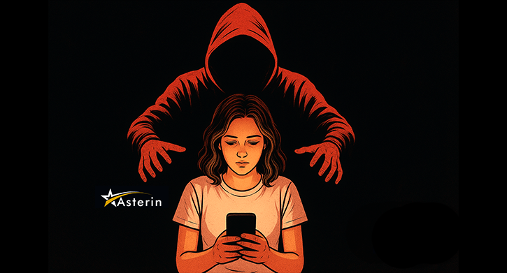 Ilustração digital em estilo gráfico mostra uma jovem sentada, iluminada pela luz amarelada de um celular que segura com as duas mãos. Atrás dela, uma figura ameaçadora com capuz vermelho e rosto oculto se inclina para a frente, com as mãos estendidas em direção a ela. O fundo é completamente escuro, criando contraste e transmitindo uma sensação de tensão e perigo.